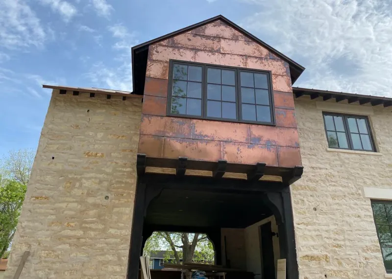Copper metal panel facade on a stone building for Skylight Installation in Boonton